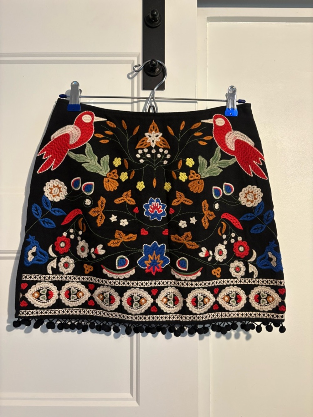 Umgee Black Mini Skirt with Multicolor Embroidered Birds & Pom Trim